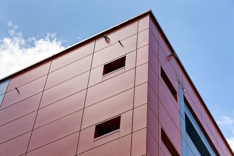 Building with exterior brown aluminium pressed panels