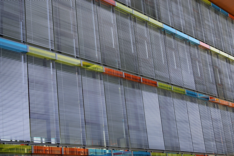 Metal louvres surrounded by stained glass